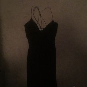 Sleek strappy black dress with high slit